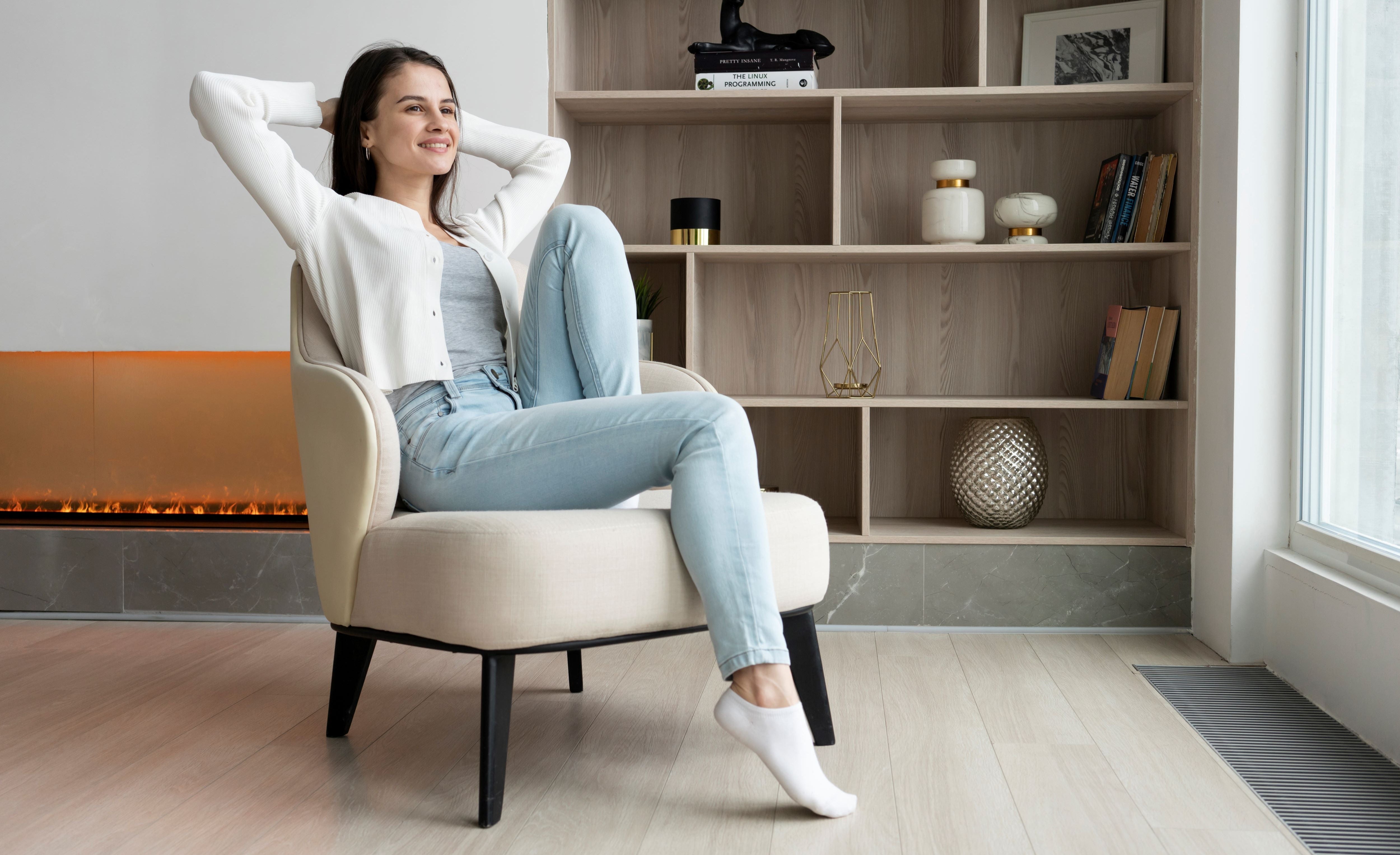 full-shot-smiley-woman-sitting-chair1.jpg